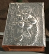 Embossed aluminum on wood 
